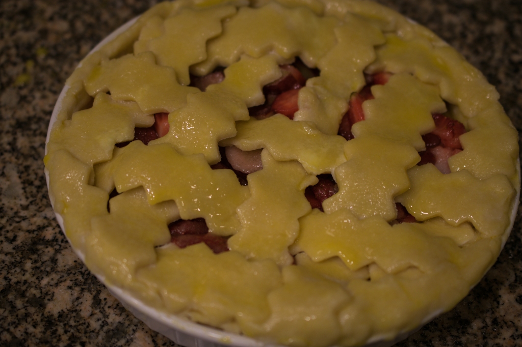 This Strawberry-Rhubarb Pie has been brushed with egg wash and is oven ready