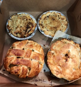 Fresh peach pies with crumble topping (top) and apple pies (bottom) from class.